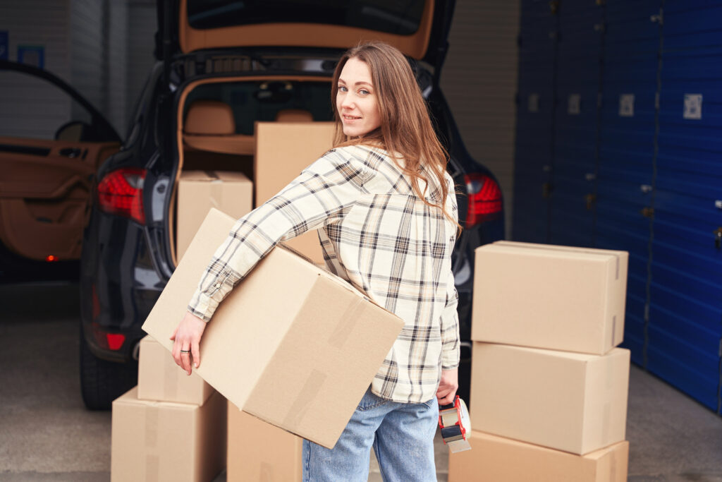 Woman moving boxes into Storage
