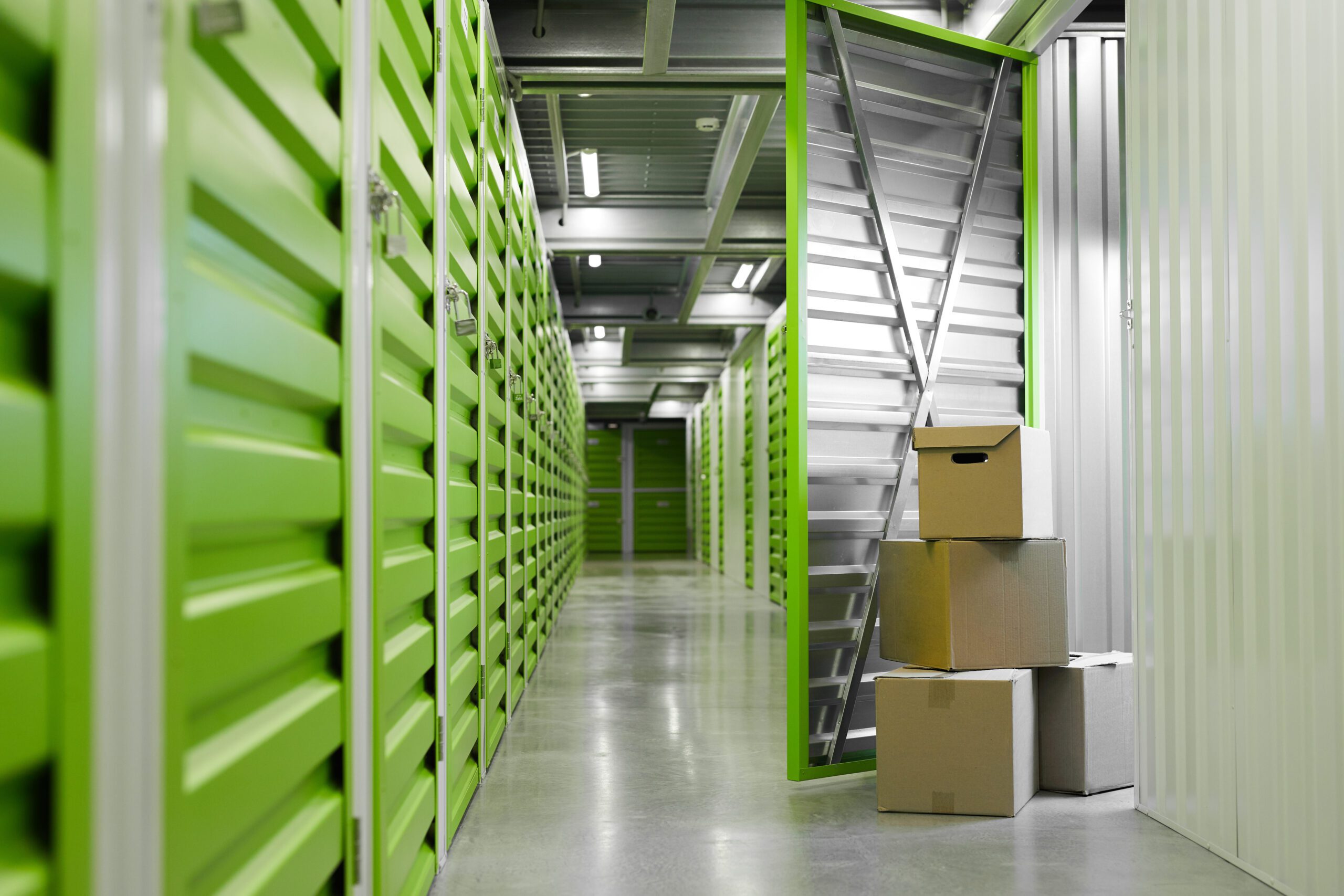 Boxes in Self Storage Unit Man Moving Boxes in Self Storage Unit